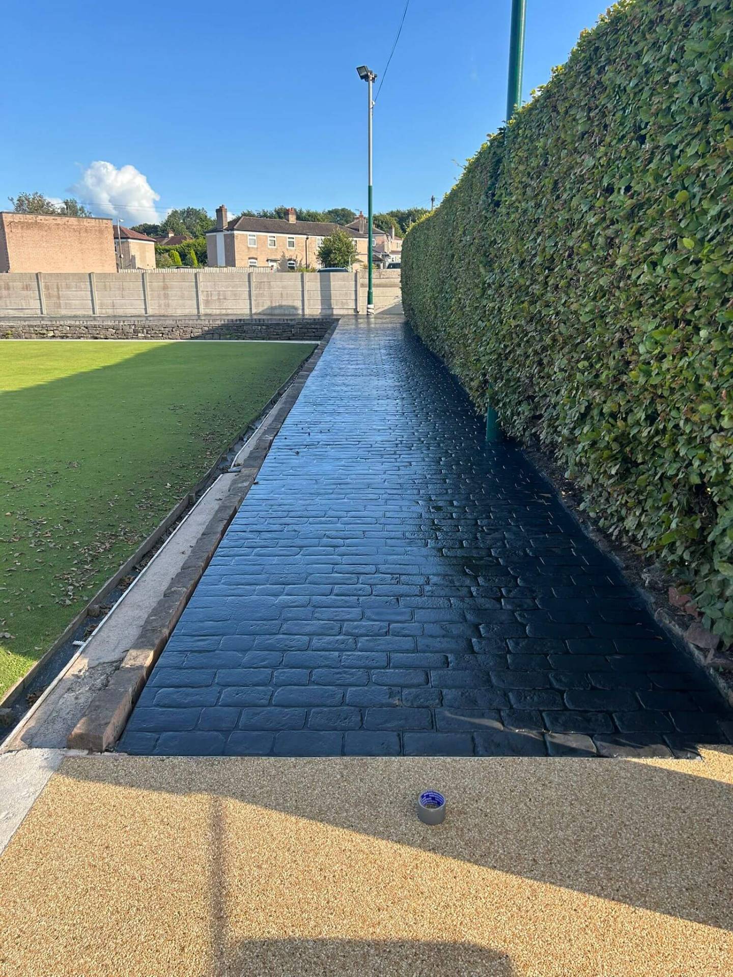 Brick pattern printed concrete path